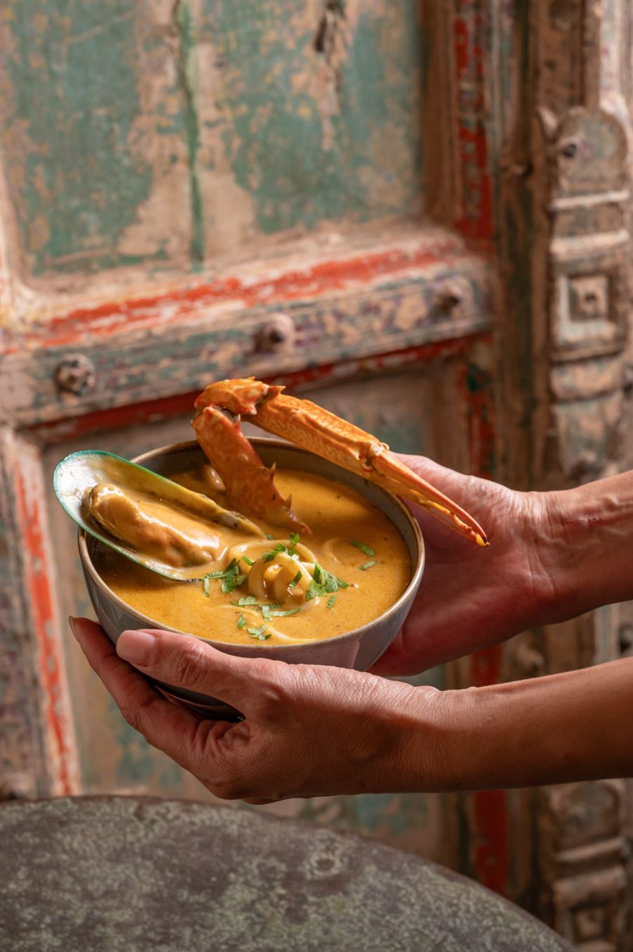 A bowl of fragrant Emirati stew being served